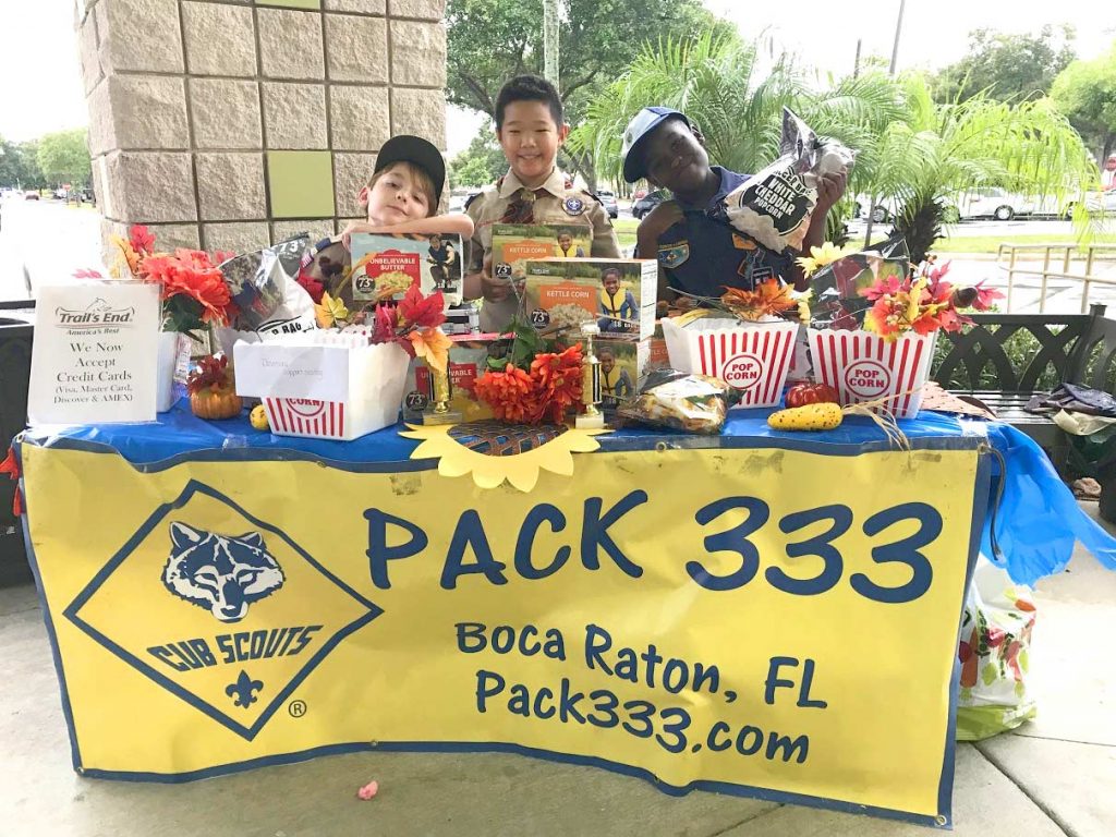 Group Photo of Cub Scouts at table in Boca Raton